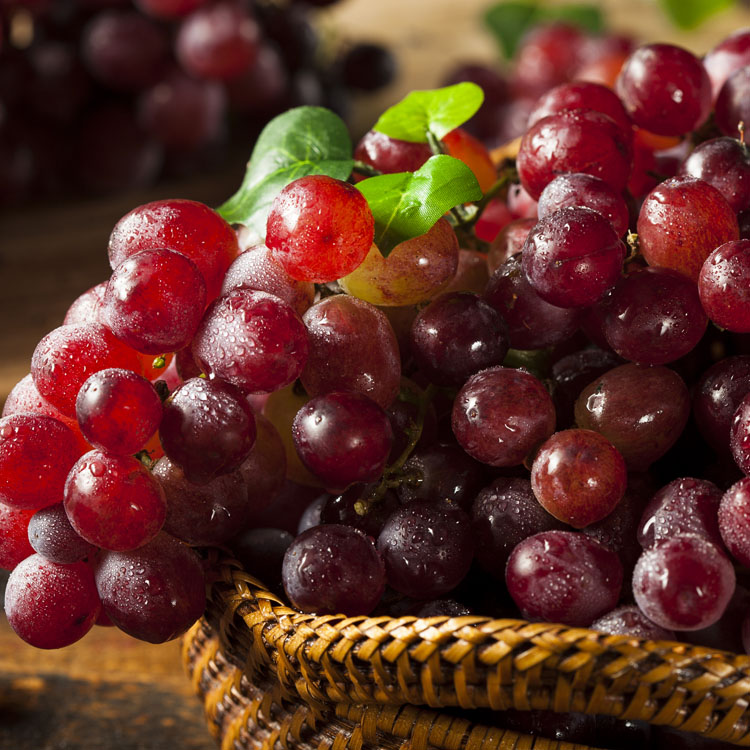 Organic Raw Red Grapes in a Basket