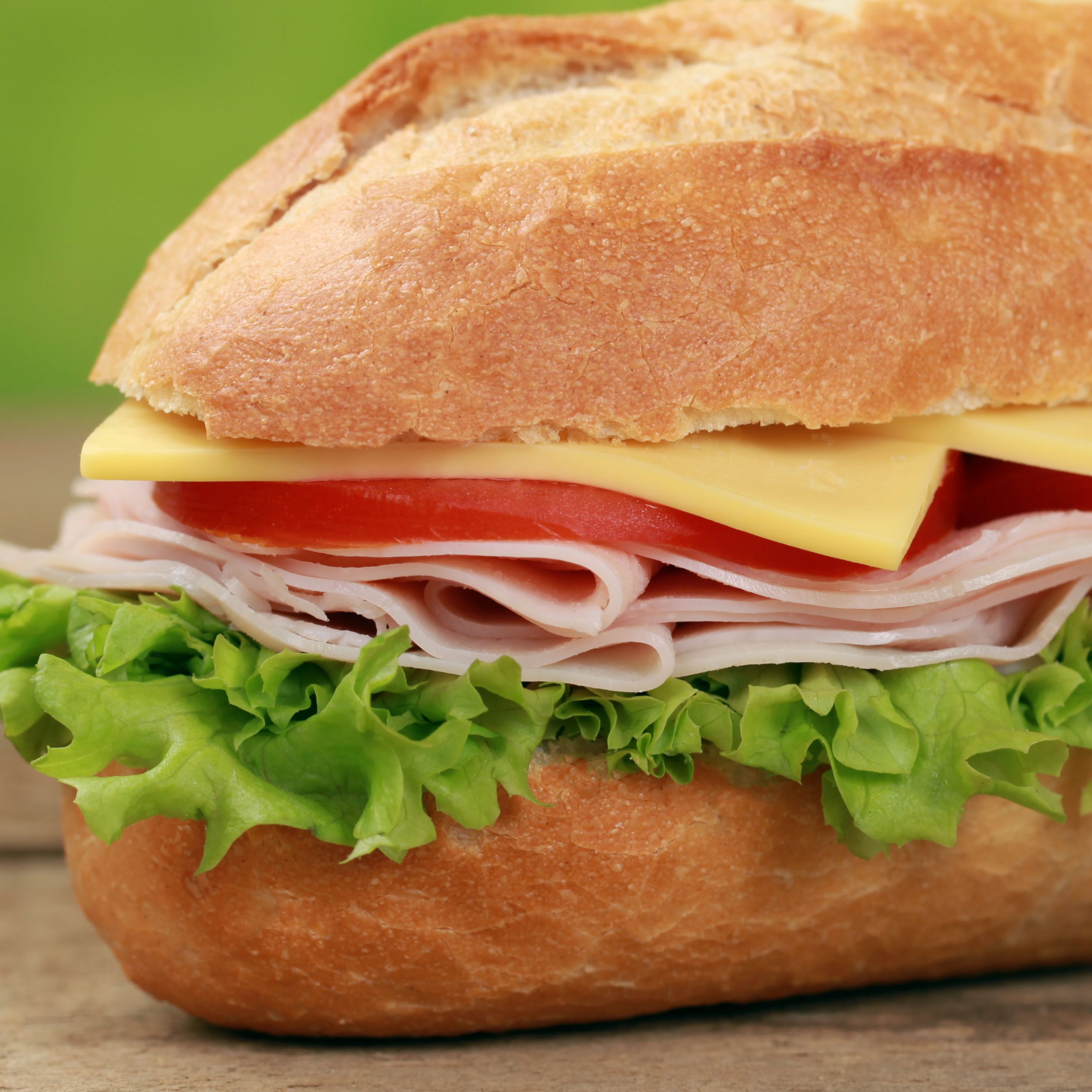 Sub Sandwiches with ham, cheese, tomatoes and lettuce